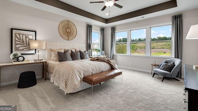 52 Sheryl Way, Loganville, GA 30052 - carpeted bedroom featuring a raised ceiling and ceiling fan