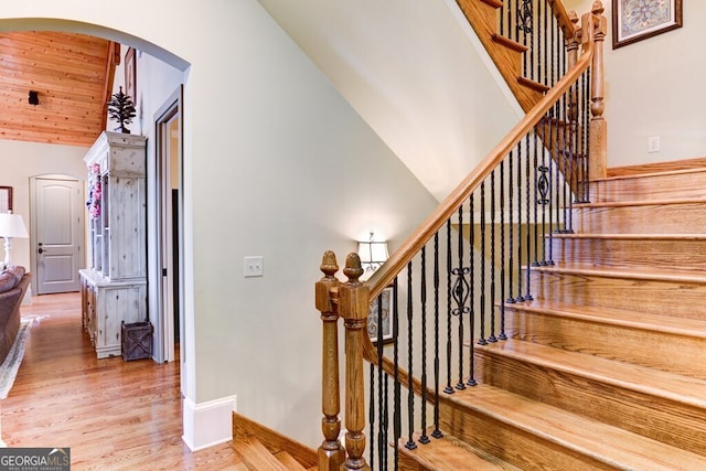 2373 Herman Drake Rd, Young Harris, GA 30582 - stairway with wood ceiling, wood finished floors, lofted ceiling, baseboards, and arched walkways