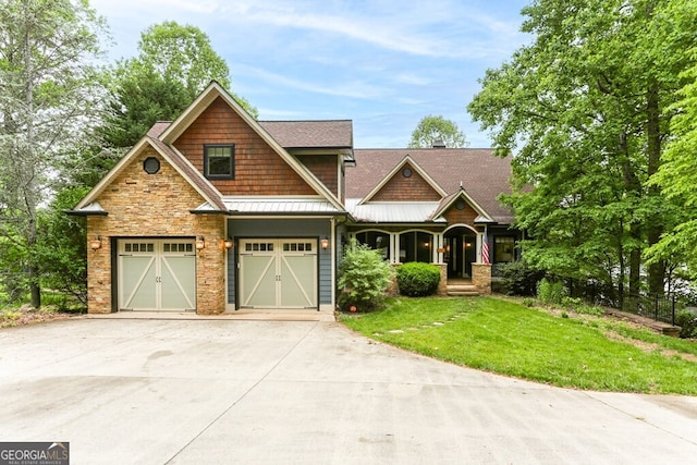 2373 Herman Drake Rd, Young Harris, GA 30582 - craftsman-style home featuring stone siding, metal roof, concrete driveway, a standing seam roof, and a front lawn