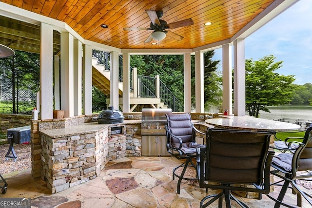 2373 Herman Drake Rd, Young Harris, GA 30582 - view of patio with ceiling fan, outdoor dining area, grilling area, stairway, and an outdoor kitchen