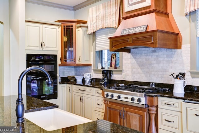 2373 Herman Drake Rd, Young Harris, GA 30582 - kitchen featuring crown molding, tasteful backsplash, glass insert cabinets, stainless steel gas stovetop, and custom exhaust hood