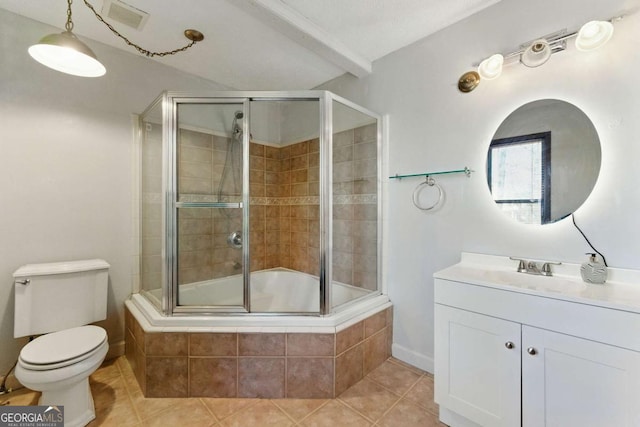 full bathroom with visible vents, toilet, vanity, tiled shower / bath, and tile patterned flooring