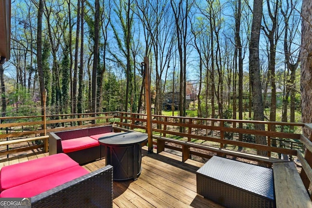 wooden deck with an outdoor hangout area