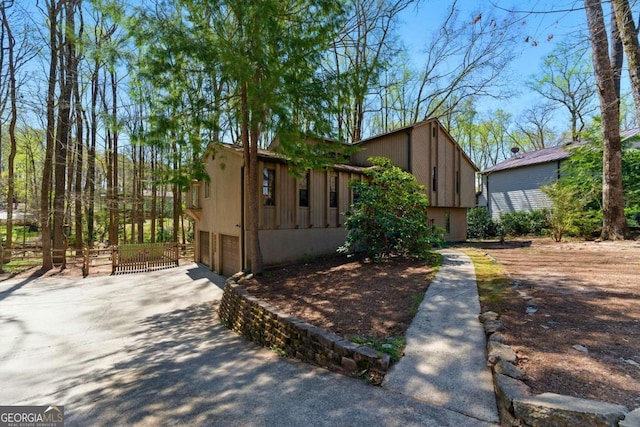 view of front of home with driveway and a garage
