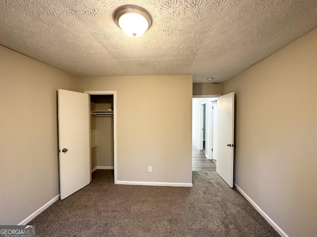 2317 Emerald Springs Dr, Decatur, GA 30035 - unfurnished bedroom featuring a closet, carpet floors, a textured ceiling, and baseboards
