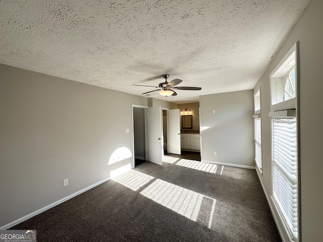 2317 Emerald Springs Dr, Decatur, GA 30035 - interior space featuring a ceiling fan, carpet floors, baseboards, and a textured ceiling