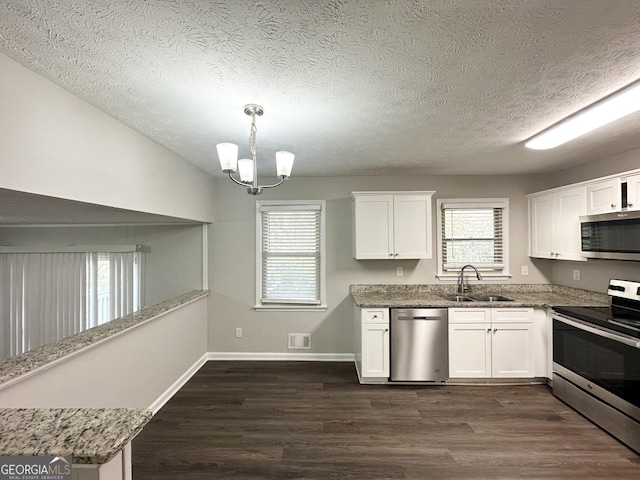 2317 Emerald Springs Dr, Decatur, GA 30035 - kitchen with a sink, white cabinets, appliances with stainless steel finishes, and dark wood-style floors