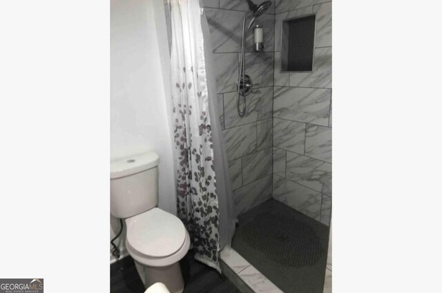 3834 Kensingwood Trce, Decatur, GA 30032 - full bath featuring toilet and a shower stall