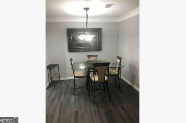 3834 Kensingwood Trce, Decatur, GA 30032 - dining room with baseboards, visible vents, crown molding, and dark wood-type flooring