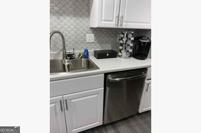 3834 Kensingwood Trce, Decatur, GA 30032 - kitchen with light countertops, a sink, tasteful backsplash, stainless steel dishwasher, and white cabinets