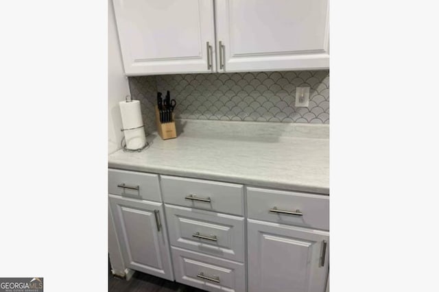 3834 Kensingwood Trce, Decatur, GA 30032 - kitchen with decorative backsplash, light countertops, and white cabinets
