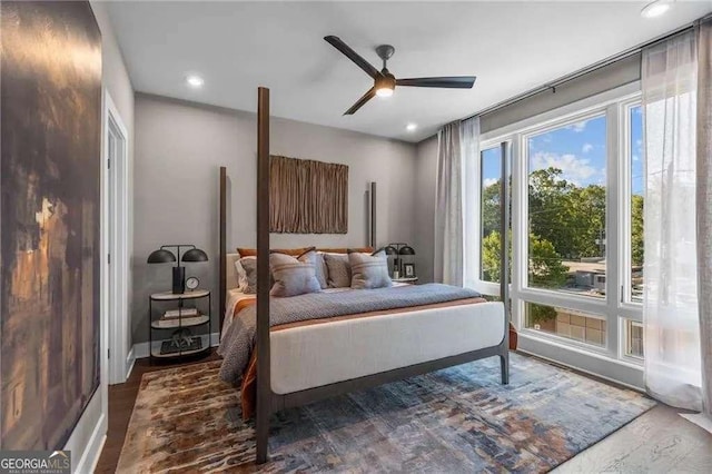 bedroom featuring ceiling fan, recessed lighting, wood finished floors, and baseboards