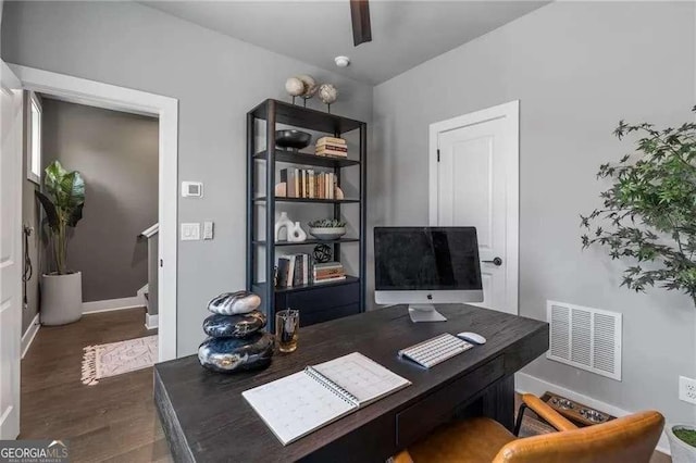 office with visible vents, baseboards, and wood finished floors
