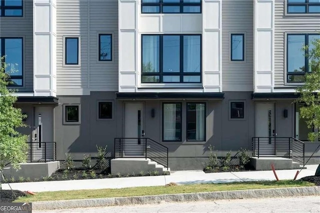 view of front of house featuring stucco siding