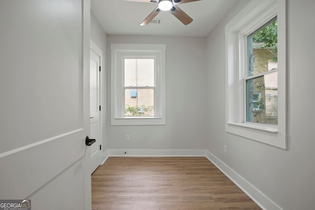 1441 Ezra Church Dr NW, Atlanta, GA 30314 - unfurnished room featuring wood finished floors, visible vents, ceiling fan, and a wealth of natural light