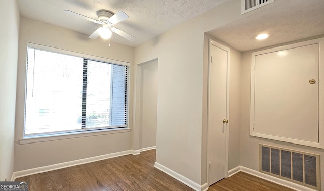 2929 Torreya Way SE, Marietta, GA 30067 - unfurnished room with baseboards, wood finished floors, a textured ceiling, ceiling fan, and healthy amount of natural light