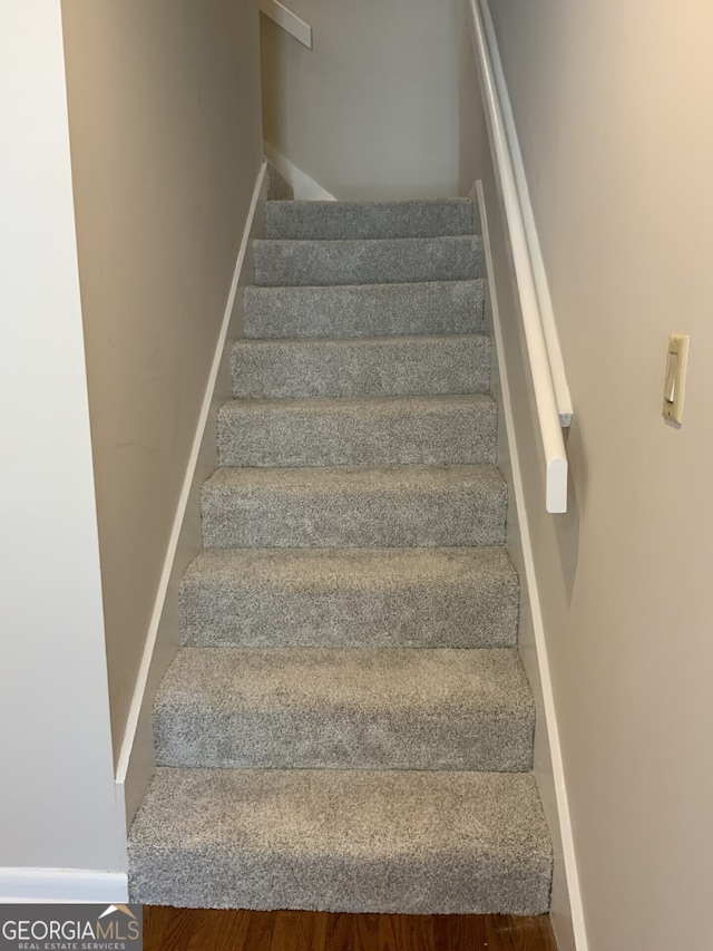 2929 Torreya Way SE, Marietta, GA 30067 - stairs with baseboards and wood finished floors