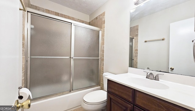 2929 Torreya Way SE, Marietta, GA 30067 - bathroom with vanity, toilet, enclosed tub / shower combo, and a textured ceiling