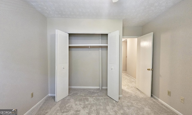 2929 Torreya Way SE, Marietta, GA 30067 - unfurnished bedroom featuring carpet, a closet, a textured ceiling, and baseboards