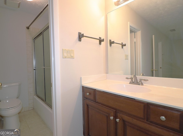 2929 Torreya Way SE, Marietta, GA 30067 - full bath featuring toilet, vanity, tile patterned flooring, bath / shower combo with glass door, and a textured ceiling
