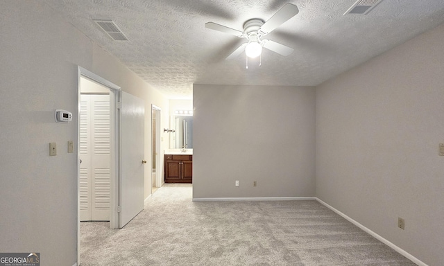 2929 Torreya Way SE, Marietta, GA 30067 - spare room featuring ceiling fan, light carpet, a textured ceiling, a sink, and baseboards