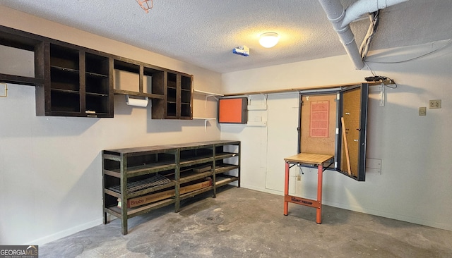 2929 Torreya Way SE, Marietta, GA 30067 - below grade area with a workshop area, a textured ceiling, and baseboards