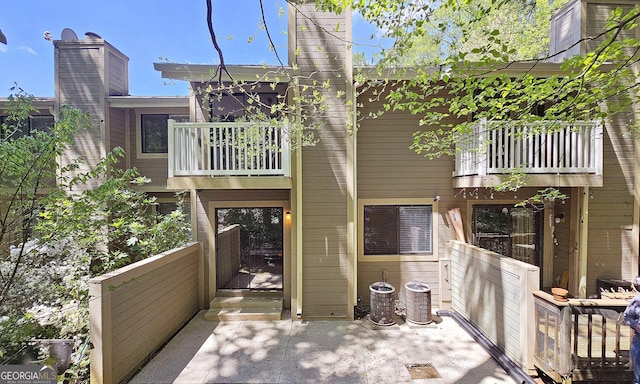 2929 Torreya Way SE, Marietta, GA 30067 - rear view of property with a balcony and a chimney