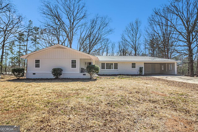 9640 Cedar Grove Rd, Fairburn, GA 30213 - ranch-style house featuring crawl space, concrete driveway, an attached carport, and a front lawn