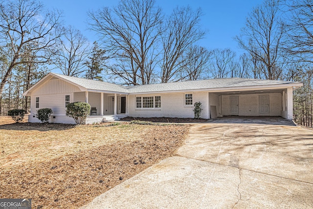 9640 Cedar Grove Rd, Fairburn, GA 30213 - single story home featuring driveway, a carport, brick siding, and covered porch
