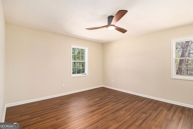 9640 Cedar Grove Rd, Fairburn, GA 30213 - unfurnished room featuring plenty of natural light, dark wood-style flooring, baseboards, and ceiling fan