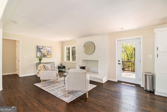 9640 Cedar Grove Rd, Fairburn, GA 30213 - living area with crown molding, dark wood-style floors, baseboards, and a brick fireplace