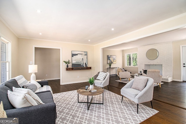 9640 Cedar Grove Rd, Fairburn, GA 30213 - living area with dark wood-style flooring, crown molding, baseboards, recessed lighting, and a brick fireplace
