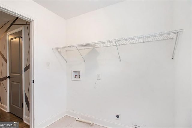 laundry area featuring hookup for a gas dryer, hookup for a washing machine, baseboards, laundry area, and hookup for an electric dryer