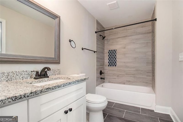 bathroom featuring shower / bath combination, toilet, and vanity