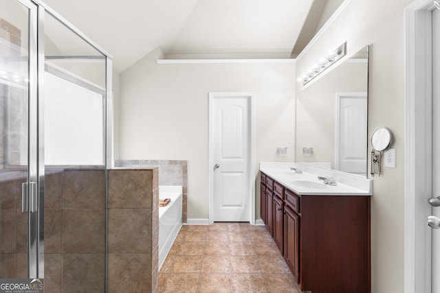 6018 Cloverfield Way, Braselton, GA 30517 - bathroom with double vanity, a garden tub, a shower stall, lofted ceiling, and baseboards