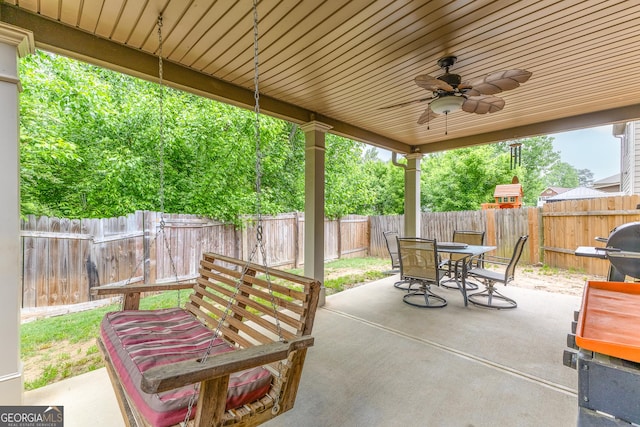 6018 Cloverfield Way, Braselton, GA 30517 - fenced backyard with outdoor dining space, a ceiling fan, and a patio area