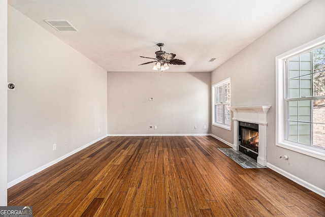 3707 Mcguire St NW, Kennesaw, GA 30144 - unfurnished living room featuring dark wood finished floors, a ceiling fan, a premium fireplace, and baseboards