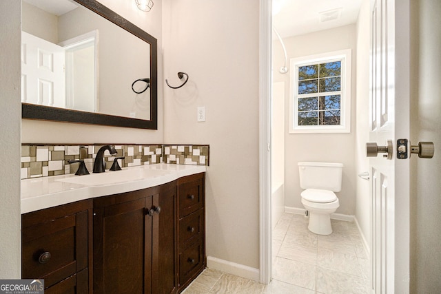 3707 Mcguire St NW, Kennesaw, GA 30144 - bathroom featuring vanity, tasteful backsplash, toilet, and baseboards