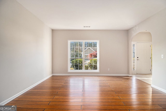 3707 Mcguire St NW, Kennesaw, GA 30144 - spare room with arched walkways, hardwood / wood-style floors, and baseboards