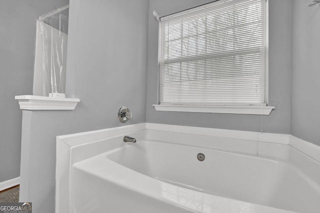 full bathroom with a garden tub