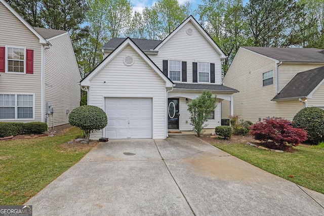 traditional-style house with a front yard, driveway, roof with shingles, and an attached garage