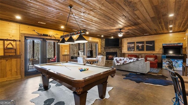 68 Shalom Vw, Blue Ridge, GA 30513 - playroom with finished concrete flooring, wood walls, wood ceiling, a stone fireplace, and ceiling fan