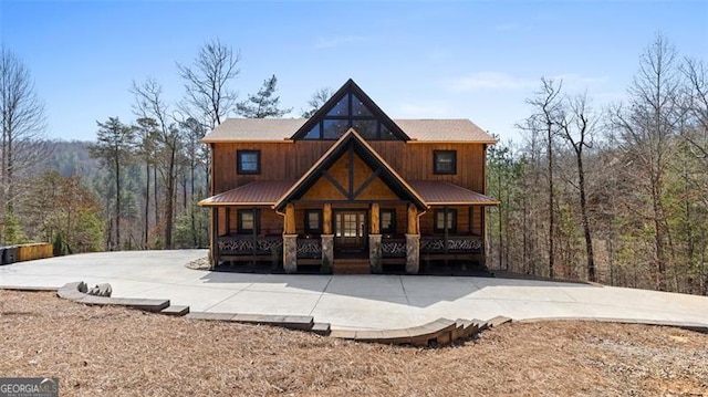 68 Shalom Vw, Blue Ridge, GA 30513 - rustic home with covered porch, metal roof, and a forest view