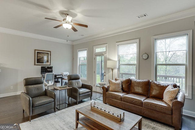 living room with a ceiling fan, baseboards, ornamental molding, dark wood-style floors, and an office area