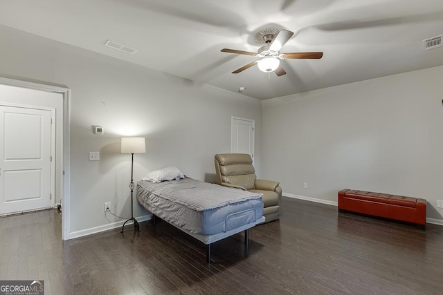 bedroom featuring baseboards, wood finished floors, and ceiling fan