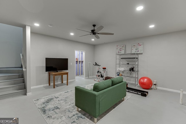 living area featuring concrete floors, stairway, ceiling fan, recessed lighting, and baseboards