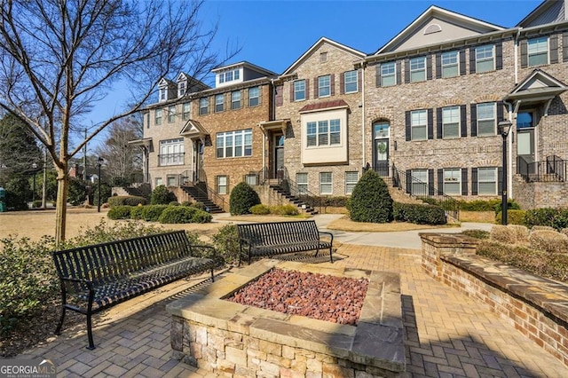 view of community featuring a residential view and stairway