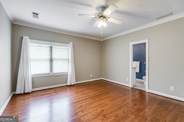 empty room with visible vents, baseboards, a ceiling fan, and wood finished floors