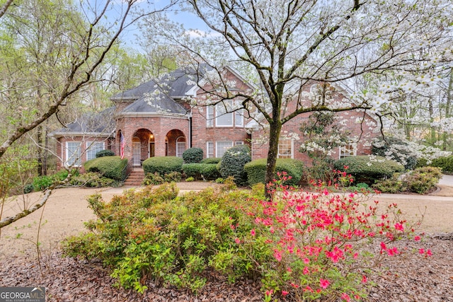 view of front of house with brick siding