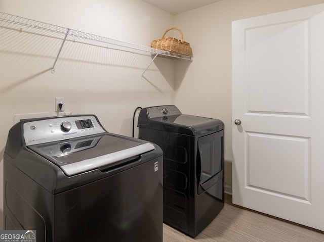 1800 Pearson St, Loganville, GA 30052 - laundry room featuring washer and dryer and laundry area